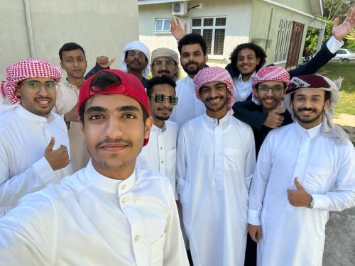 Abdullah Abdul Qader Babutain, wearing sunglasses, is with his friends after performing the Eid al-Adha prayer